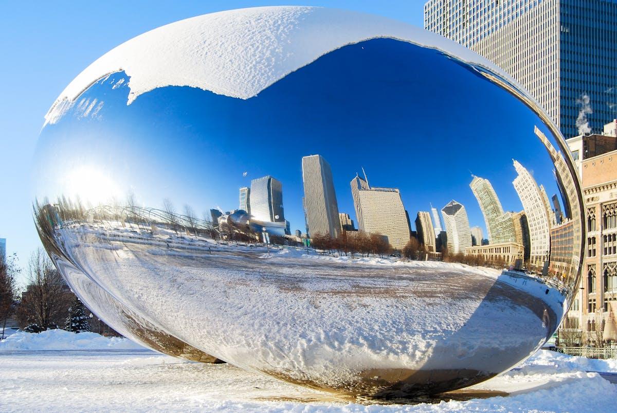 Photo by Frank Schrader: Cloud Gate (The Chicago Bean) winter reflection in Chicago. There is snow on the ground but it is a sunny winter day. Is Chicago Walkable In The Winter?