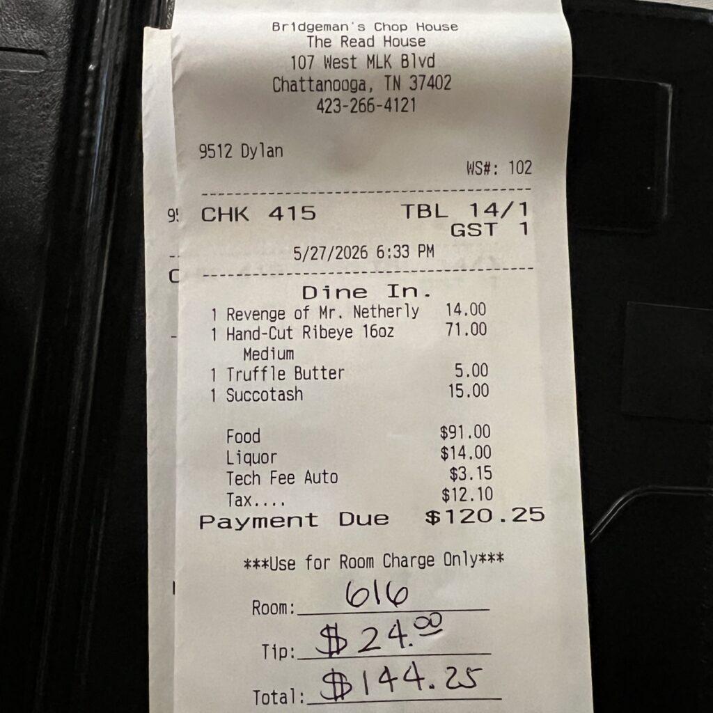 Itemized dinner receipt from Bridgeman's Chophouse in Chattanooga showing the ribeye, cocktail, tax, and total